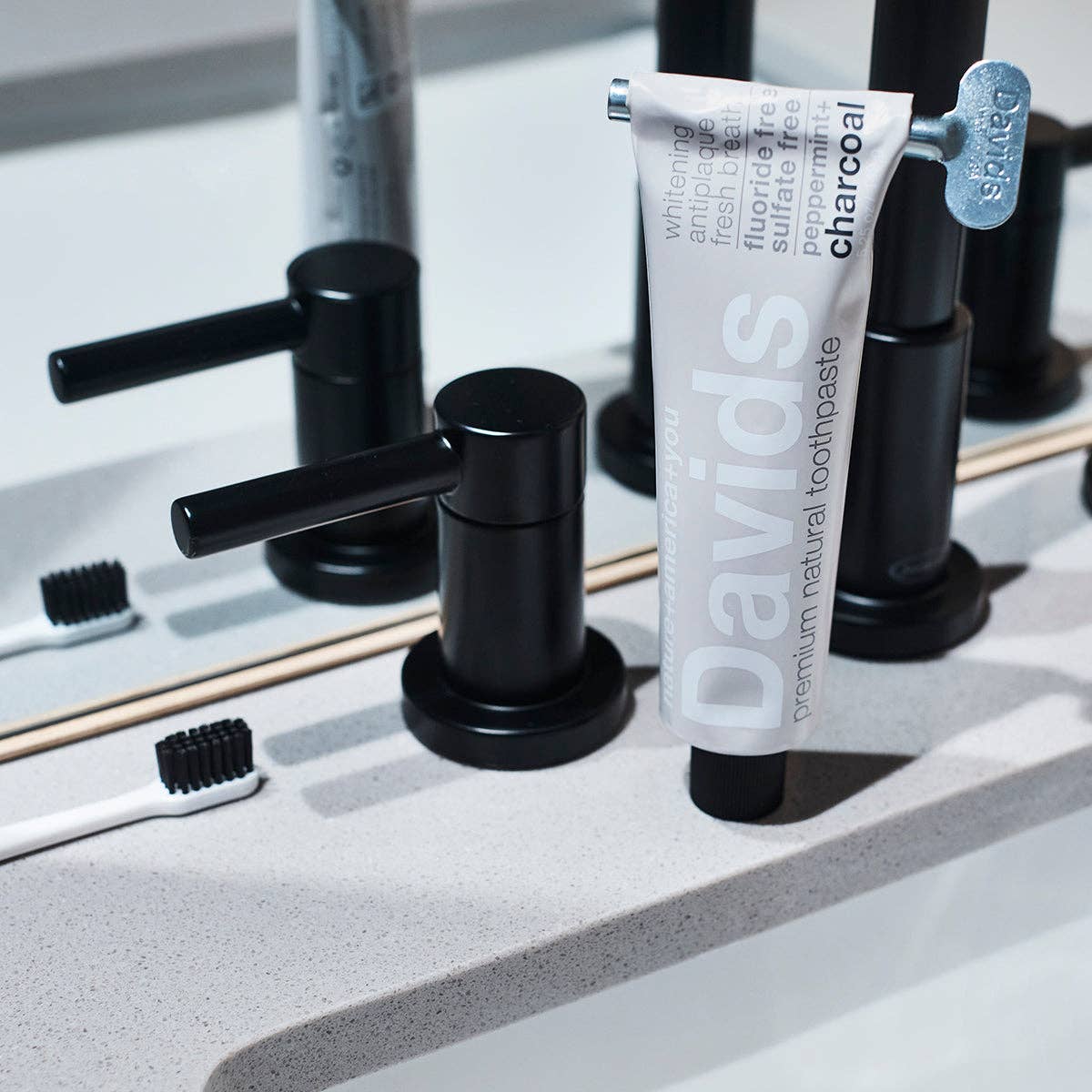 Davids Premium Natural Toothpaste - Charcoal and Peppermint flavour packaging with key