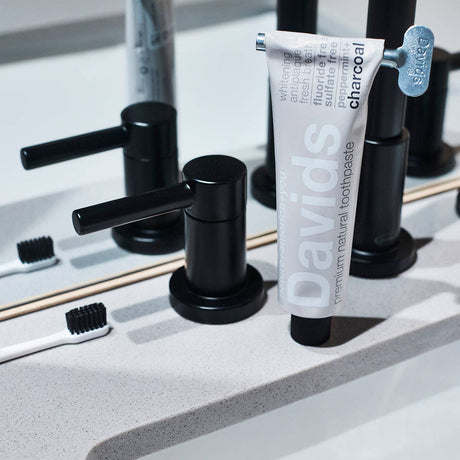 Davids Premium Natural Toothpaste - Charcoal and Peppermint flavour packaging with key
